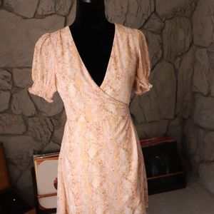 Leli's pink snake wrap dress